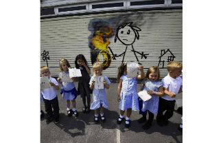 Banksy painting at Bridge Farm School. Image source: Instagram