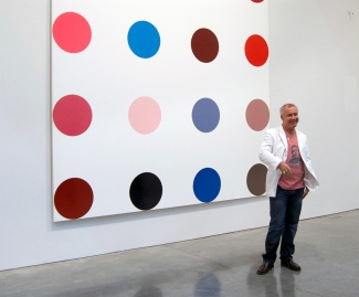 Damien Hirst at the exhibition “Damien Hirst The Complete Spot Paintings 1986-2011”, Gagosian Gallery, New York. Image: Andrew Russeth, New York. Source: Wikimedia Commons