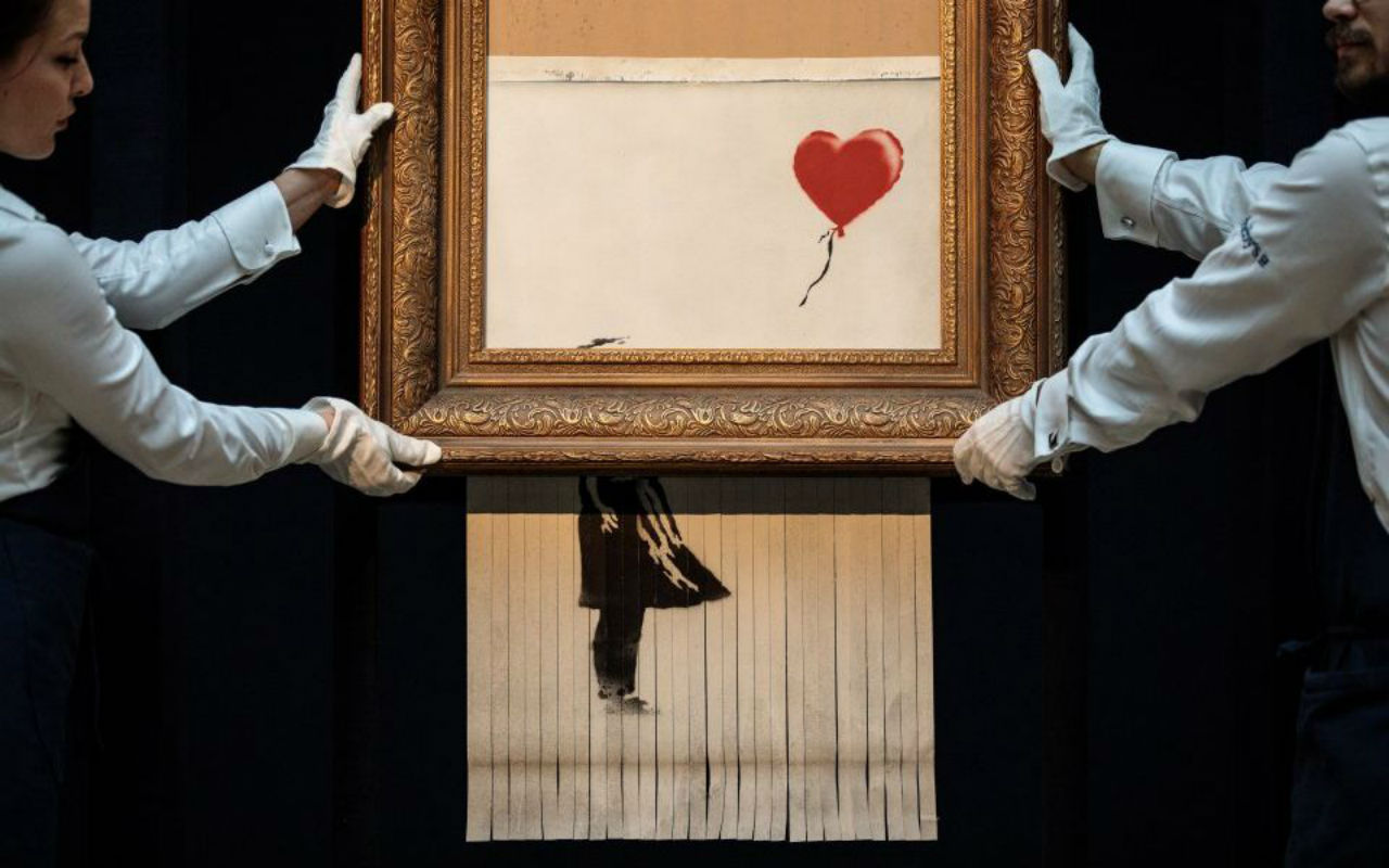 Banksy’s Shredded Girl with Balloon at Sotheby’s London, 2018. Image: via City A.M.