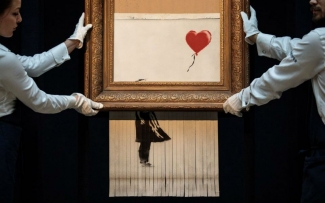 Banksy’s Shredded Girl with Balloon at Sotheby’s London, 2018. Image: via City A.M.